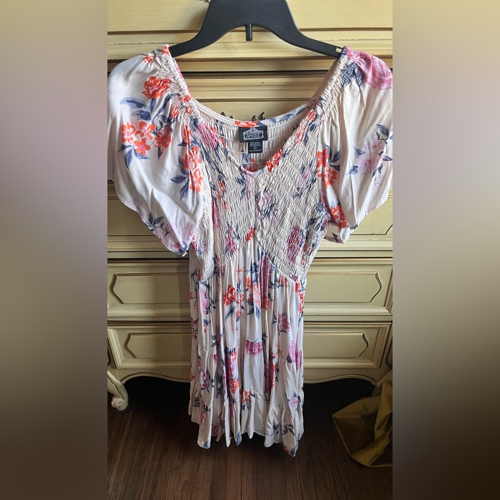 Beautiful dress with vibrant floral patterns. Perfect for summer festivals